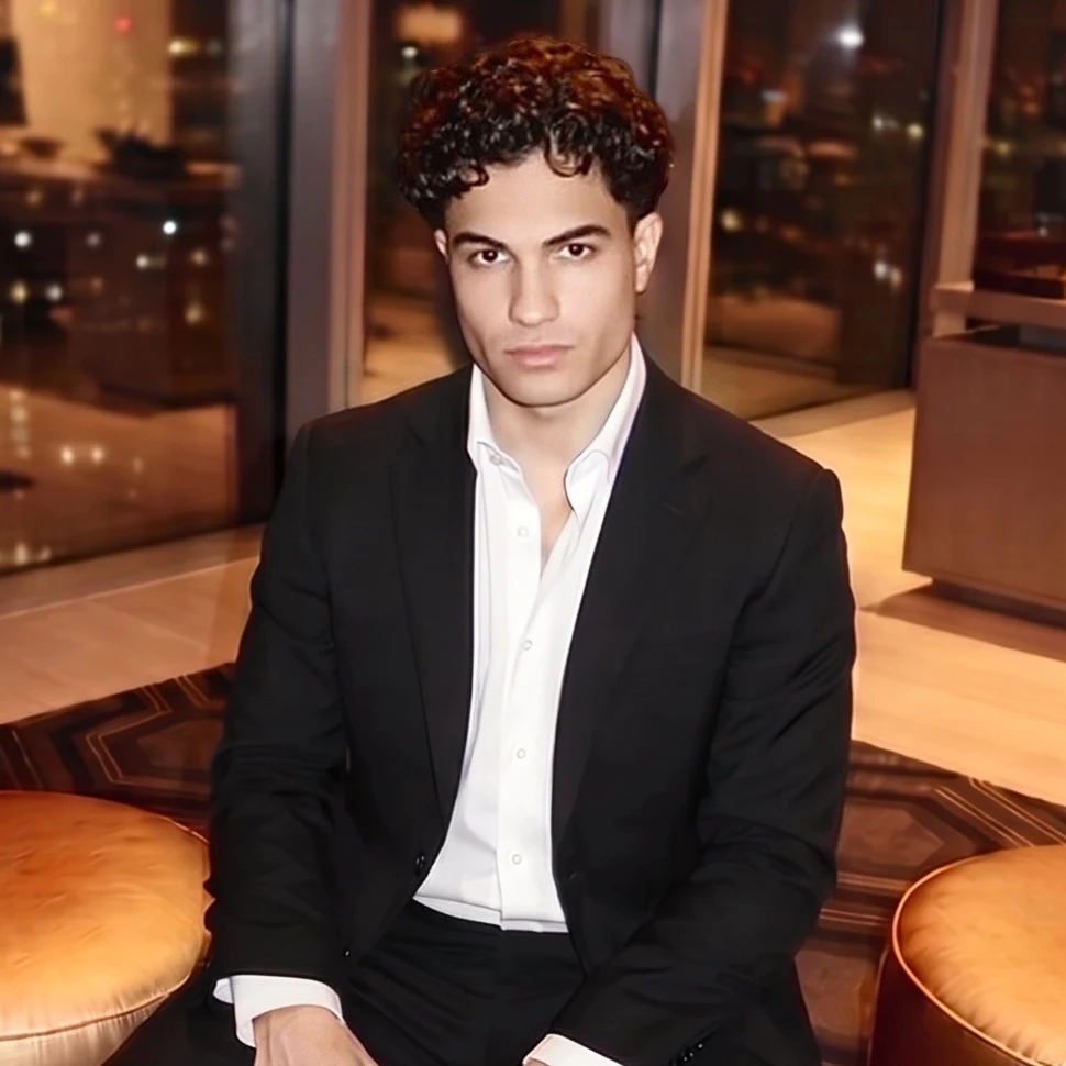 Arnav Jamwal, entrepreneur and founder of Jamwal Group, in a black suit